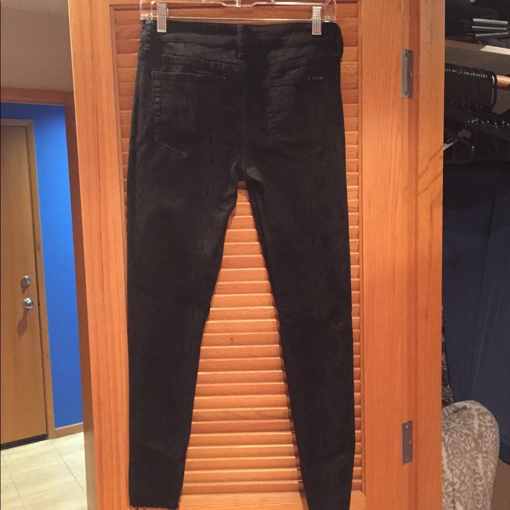 Joe’s snake pattern black jeans.